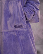 Close-up detail of The Original in Very Perri Purple featuring the ultra-soft Velveluxe™ exterior, oversized kangaroo pocket, embroidered logo, and premium construction details.