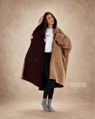 Woman modeling the Teddy Bear Full-Zip in Chocolate/Camel, showcasing the reversible double-layer CloudSherpa™ design and oversized comfort.