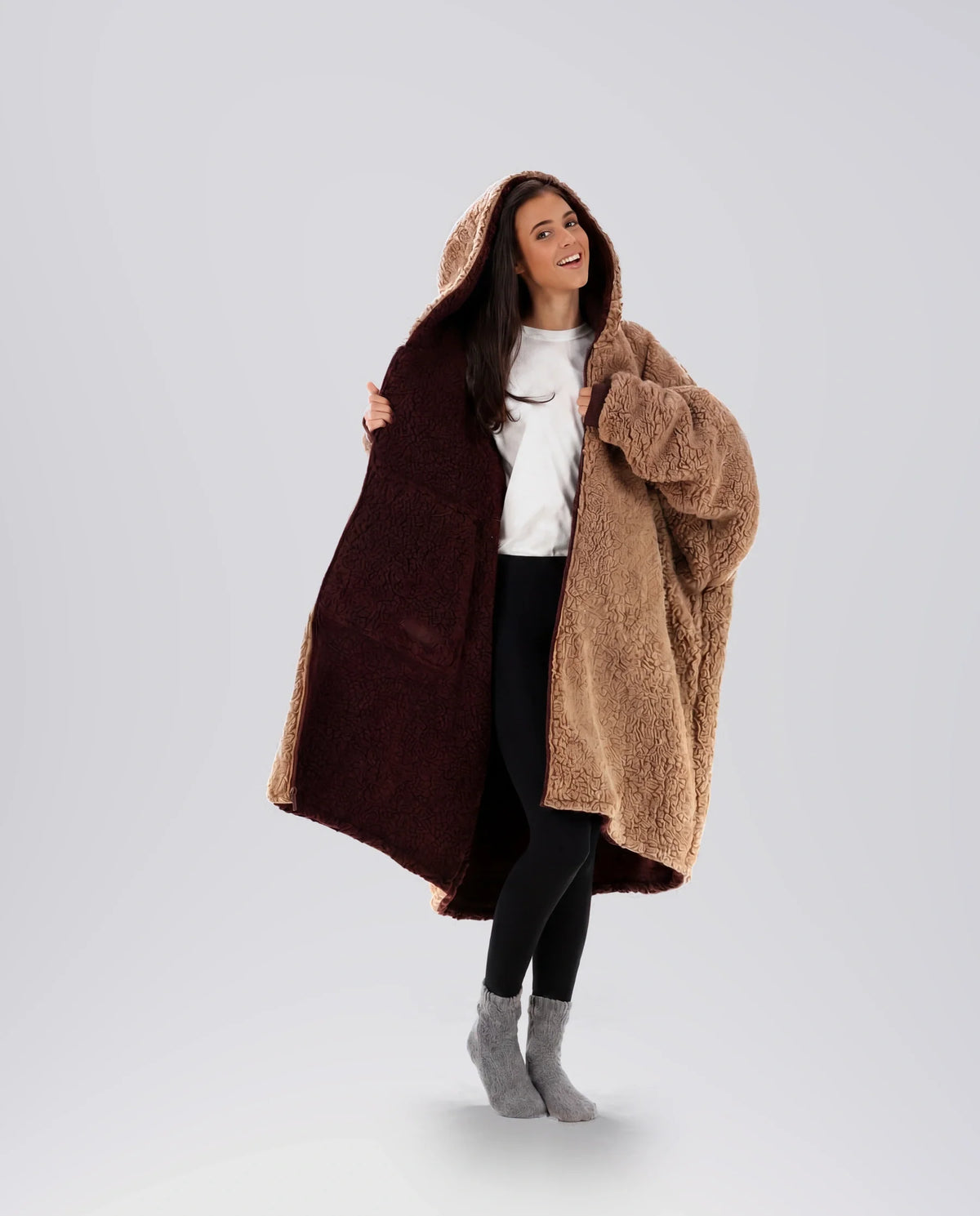 Woman modeling the Teddy Bear Full-Zip in Chocolate/Camel, showcasing the reversible double-layer CloudSherpa™ design and oversized comfort.