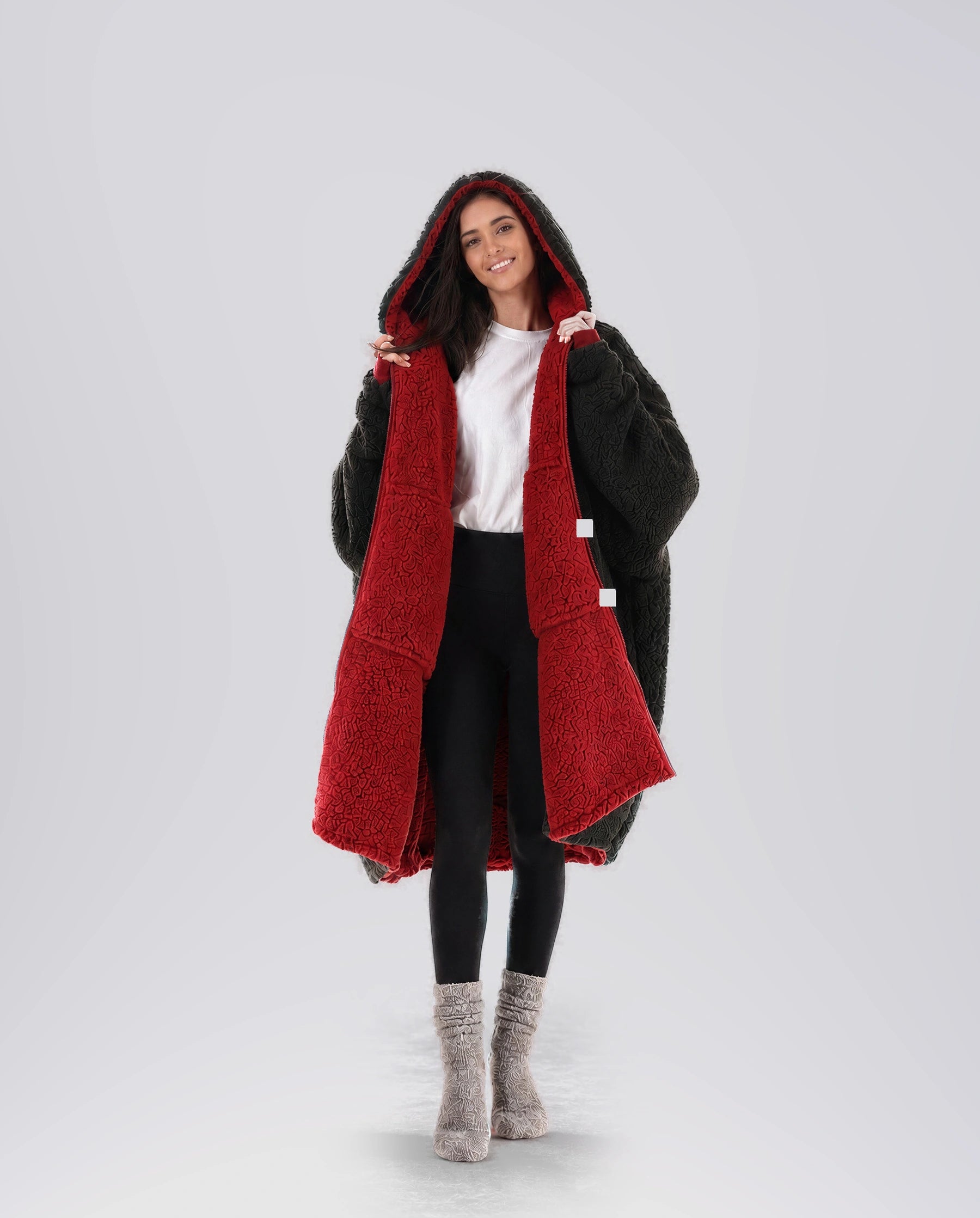 Woman modeling the Teddy Bear Full-Zip in Crimson/Black, showcasing the reversible double-layer CloudSherpa™ design and oversized fit.