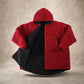 Product flat lay showcasing the Teddy Bear Full-Zip reversed to the Black side, emphasizing dual-sided versatility and premium CloudSherpa™ softness.