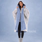 Woman modeling the Teddy Bear Full-Zip in Denim/Light Gray, highlighting the reversible double-layer CloudSherpa™ design and oversized comfort.