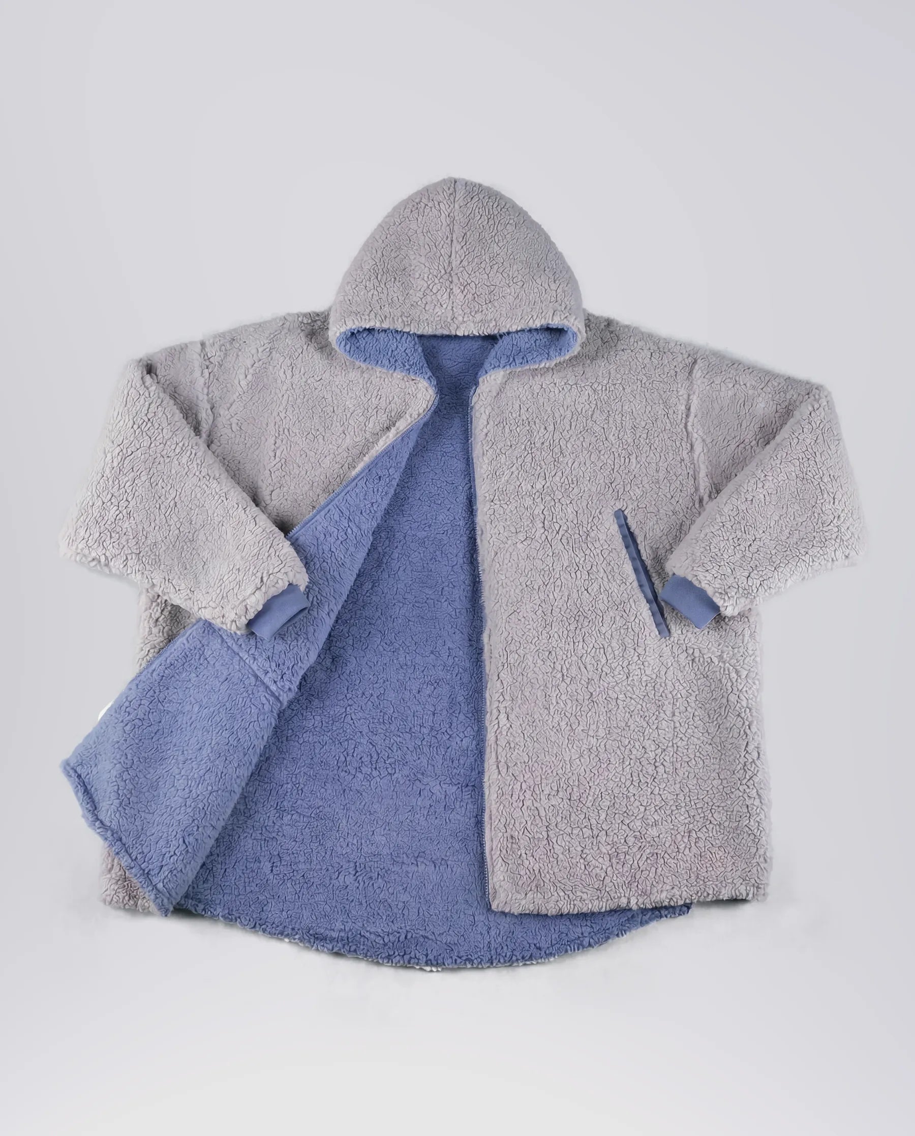 Product flat lay of the Teddy Bear Full-Zip in Light Gray, showcasing the plush CloudSherpa™ texture, oversized hood, and full-zip construction.