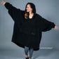Front view of The Teddy Bear Quarter-Zip wearable blanket in black showing oversized fit and all-over CloudSherpa™ texture