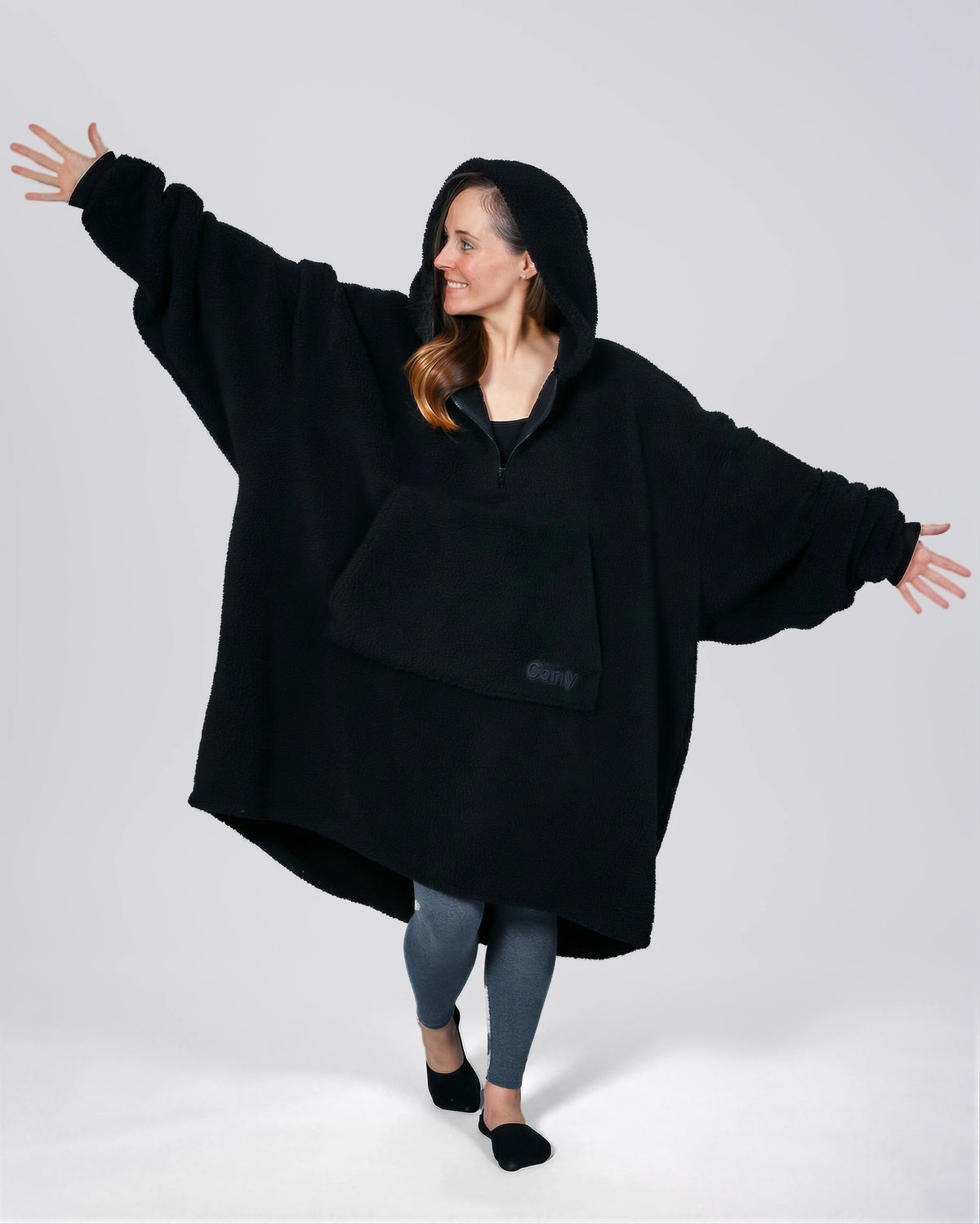 Front view of The Teddy Bear Quarter-Zip wearable blanket in black showing oversized fit and all-over CloudSherpa™ texture
