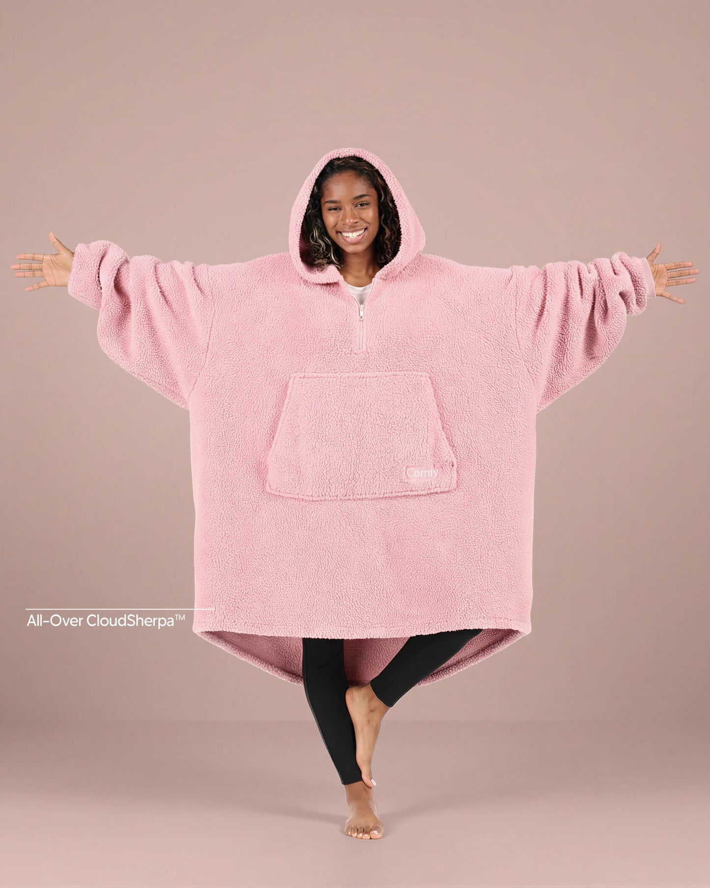 Front view of The Teddy Bear Quarter-Zip wearable blanket in blush showing oversized fit and all-over CloudSherpa™ fabric with hood up