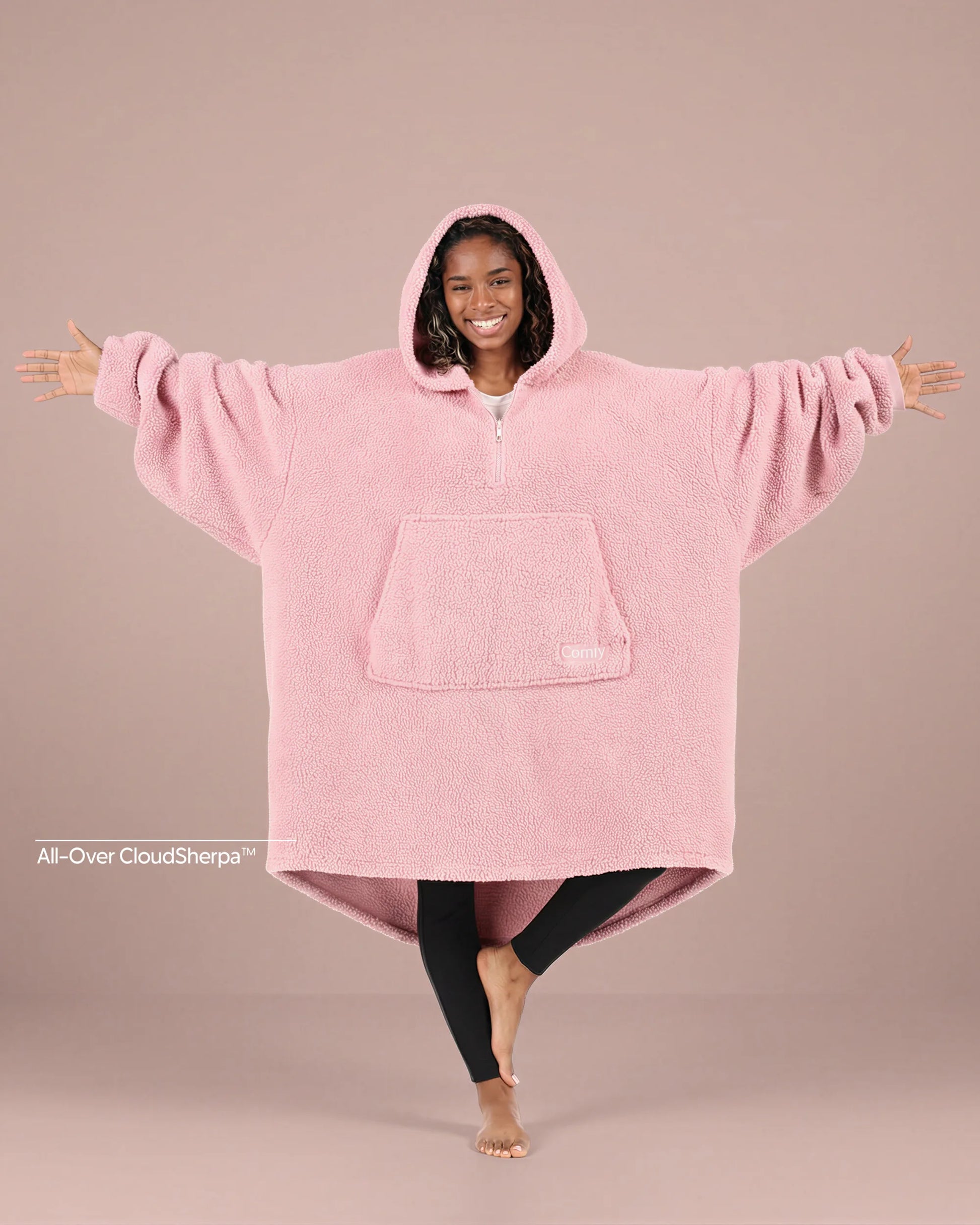 Front view of The Teddy Bear Quarter-Zip wearable blanket in blush showing oversized fit and all-over CloudSherpa™ fabric with hood up