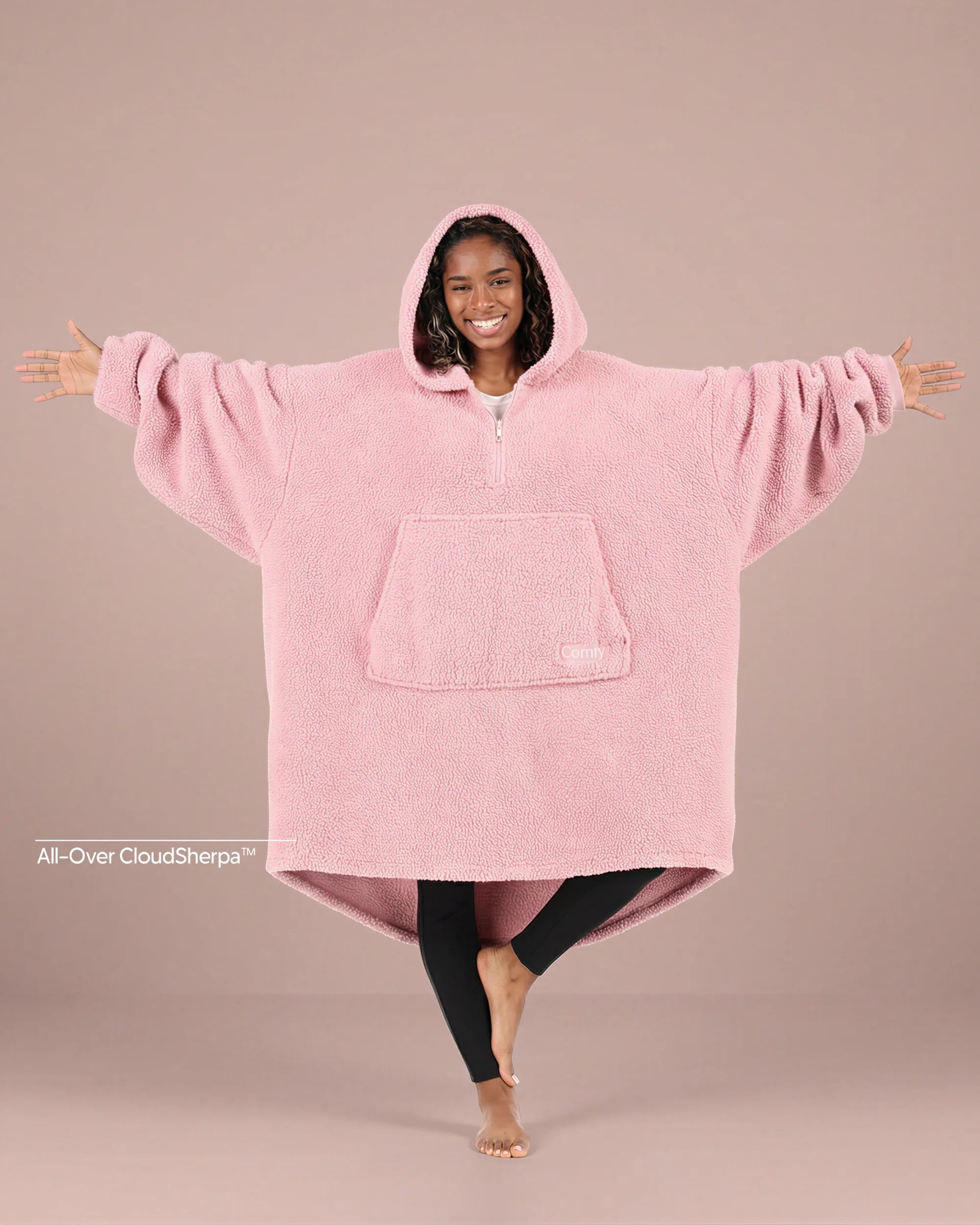 Front view of The Teddy Bear Quarter-Zip wearable blanket in blush showing oversized fit and all-over CloudSherpa™ fabric with hood up