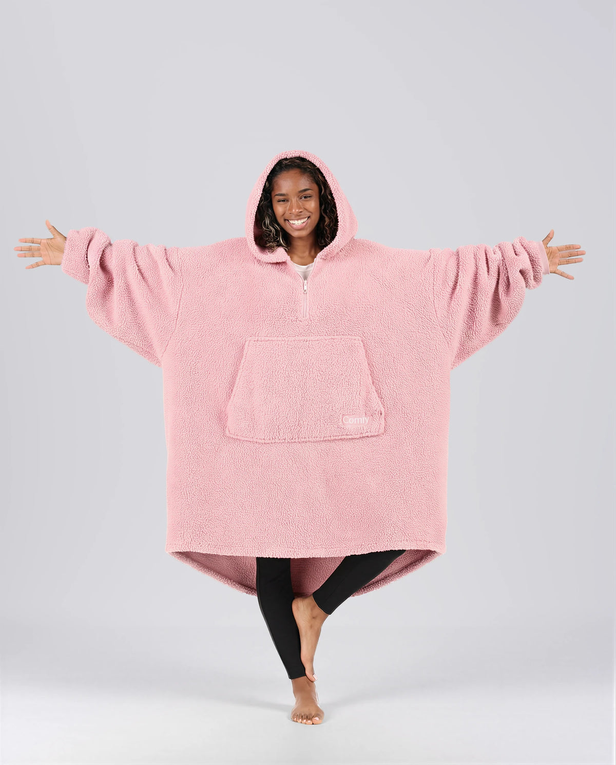 Front view of The Teddy Bear Quarter-Zip wearable blanket in blush showing oversized fit and all-over CloudSherpa™ fabric with hood up
