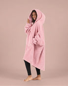 Side view of The Teddy Bear Quarter-Zip wearable blanket in blush highlighting relaxed drape, hood, and plush CloudSherpa™ texture