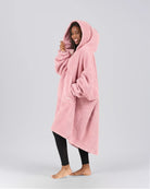 Side view of The Teddy Bear Quarter-Zip wearable blanket in blush highlighting relaxed drape, hood, and plush CloudSherpa™ texture