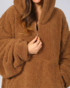 Close-up of The Teddy Bear Quarter-Zip wearable blanket in camel highlighting quarter-zip neckline and plush CloudSherpa™ texture