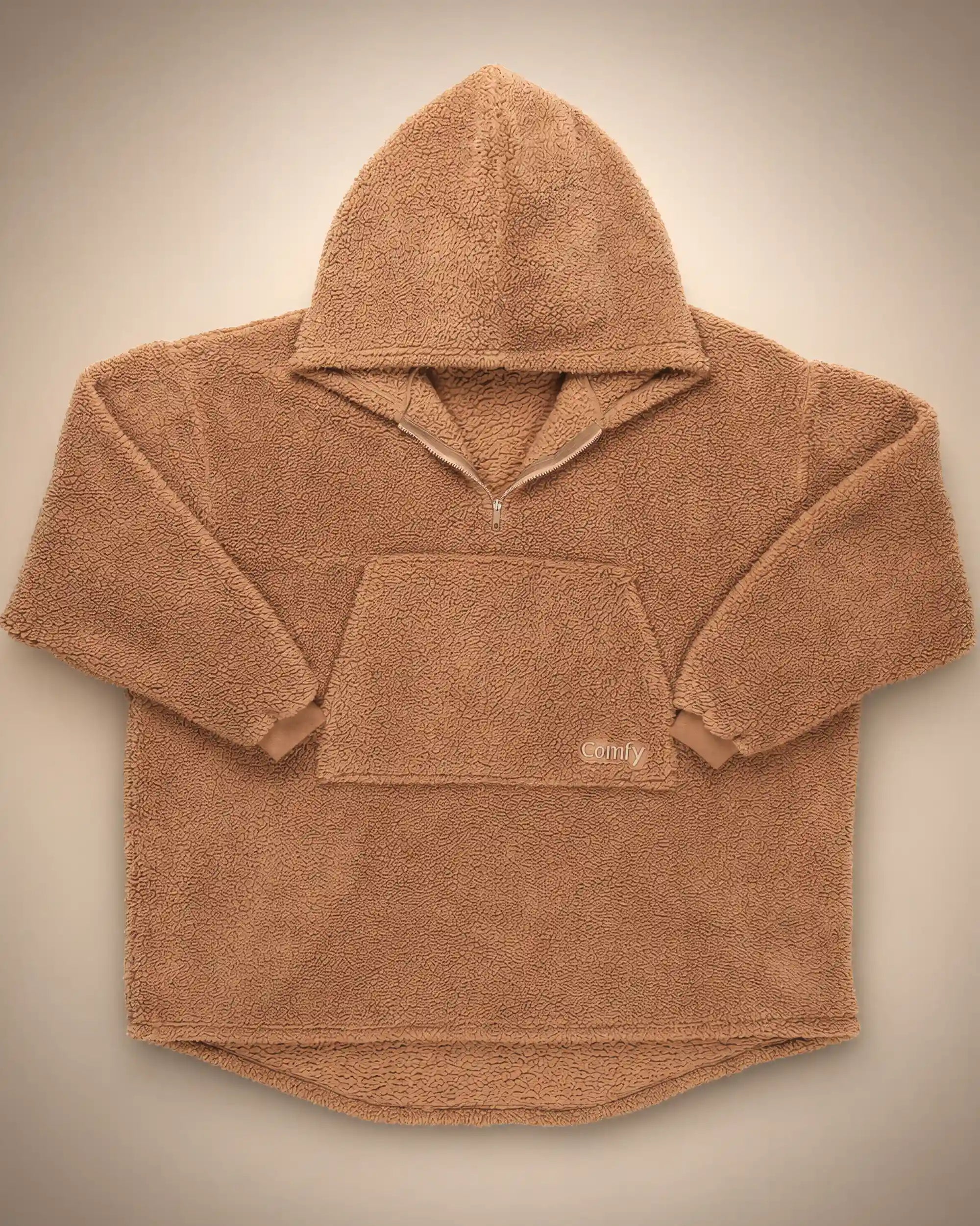 Flat lay of The Teddy Bear Quarter-Zip wearable blanket in camel displaying full shape, hood, front pocket, and all-over CloudSherpa™ construction