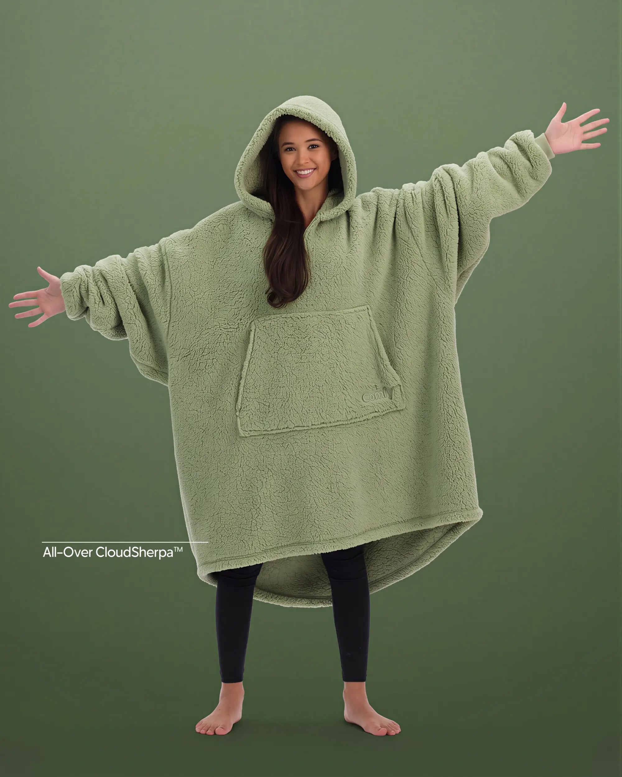 Front view of The Teddy Bear Quarter-Zip wearable blanket in cucumber showing oversized fit and all-over CloudSherpa™ fabric with hood up and arms extended