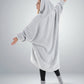 Back view of The Teddy Bear Quarter-Zip wearable blanket in light gray highlighting oversized drape and hooded silhouette