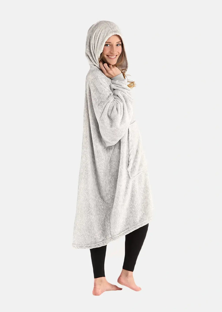 Girl wearing gray wearable blanket from The Comfy