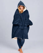 Front view of The Original wearable blanket in blue showing relaxed oversized fit and full coverage