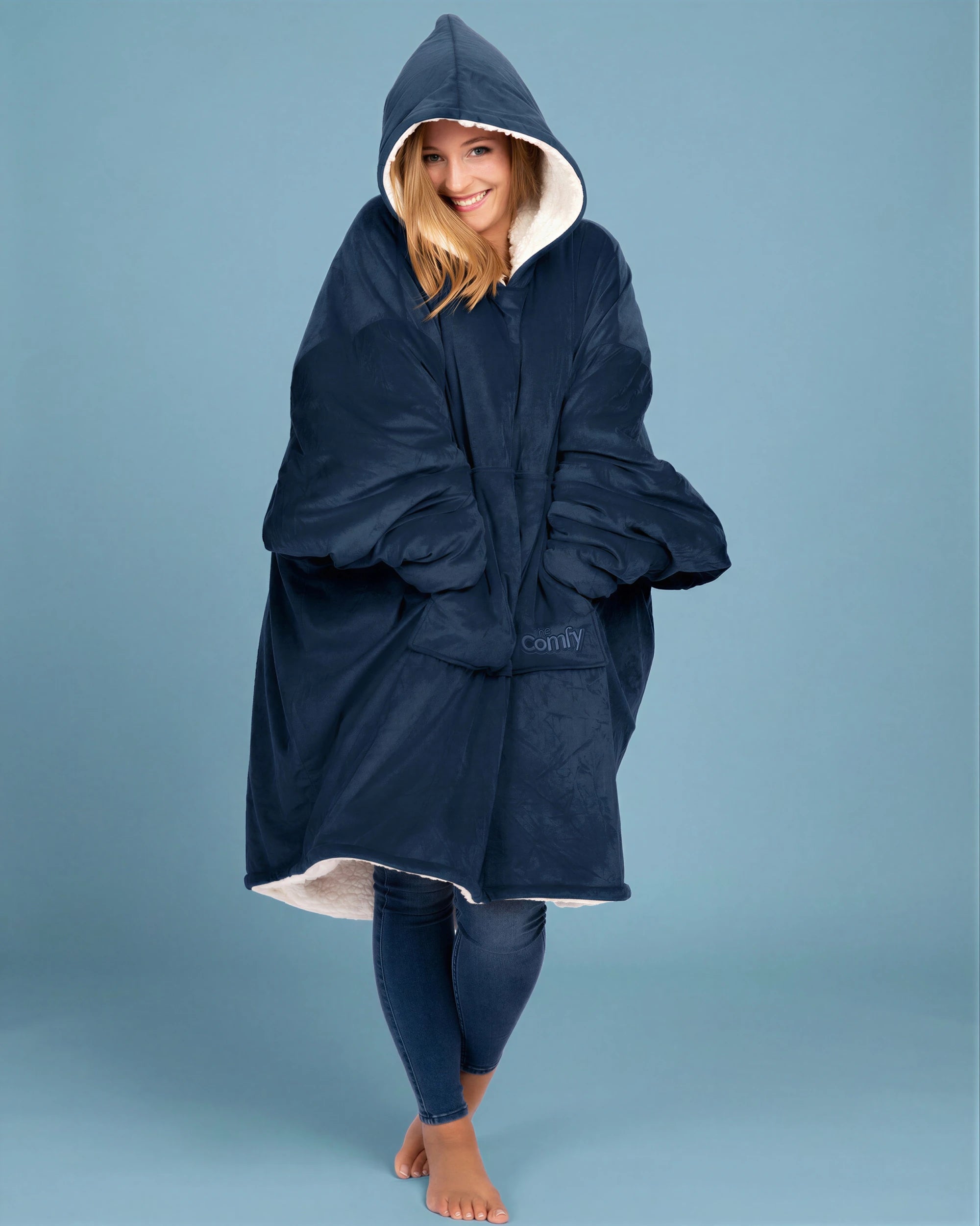Front view of The Original wearable blanket in blue showing relaxed oversized fit and full coverage