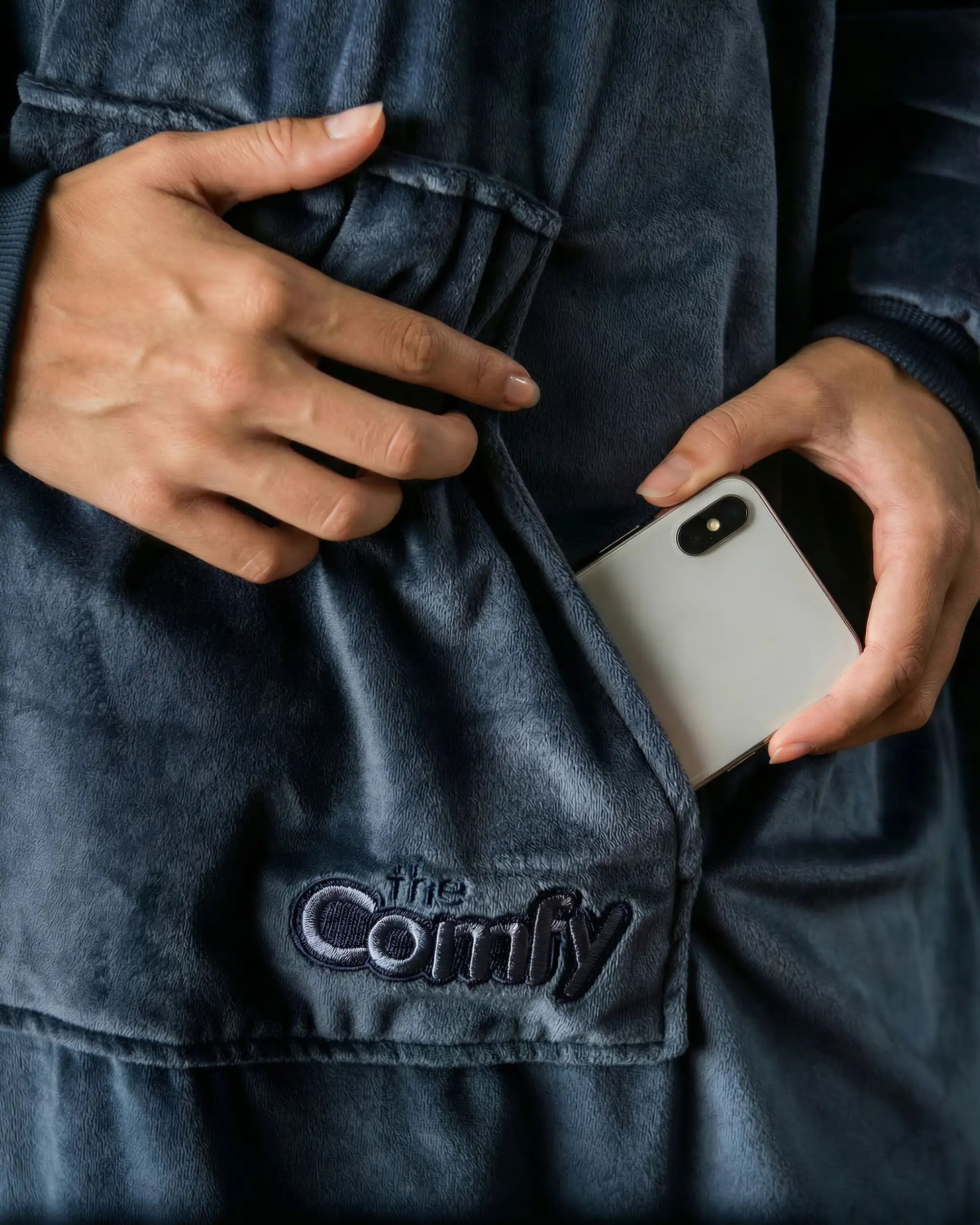 Close-up view of The Original wearable blanket in blue showing hood with soft CloudSherpa™ lining