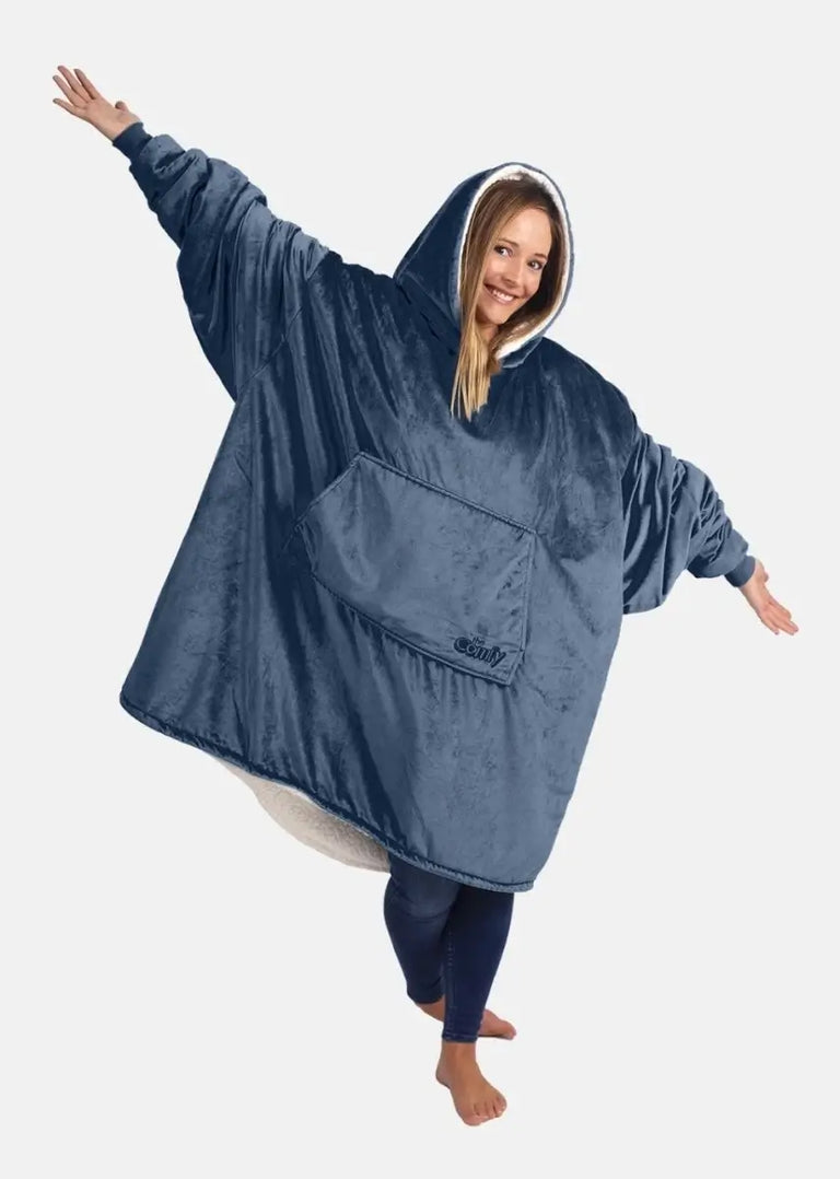 Young woman wearing a blue wearable The Comfy blanket